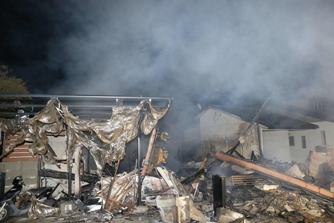 Smoke rises from burnt houses in the town of Mashiki